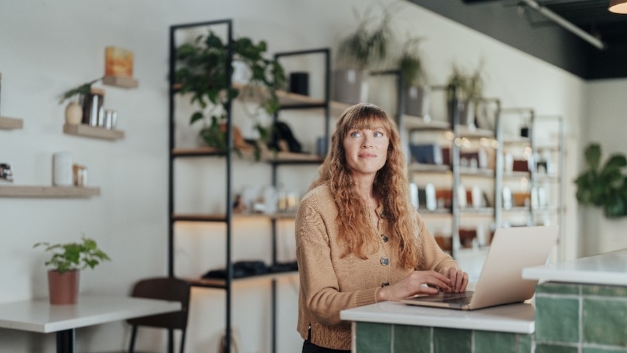 Business owner Anna Seear using her laptop at work.