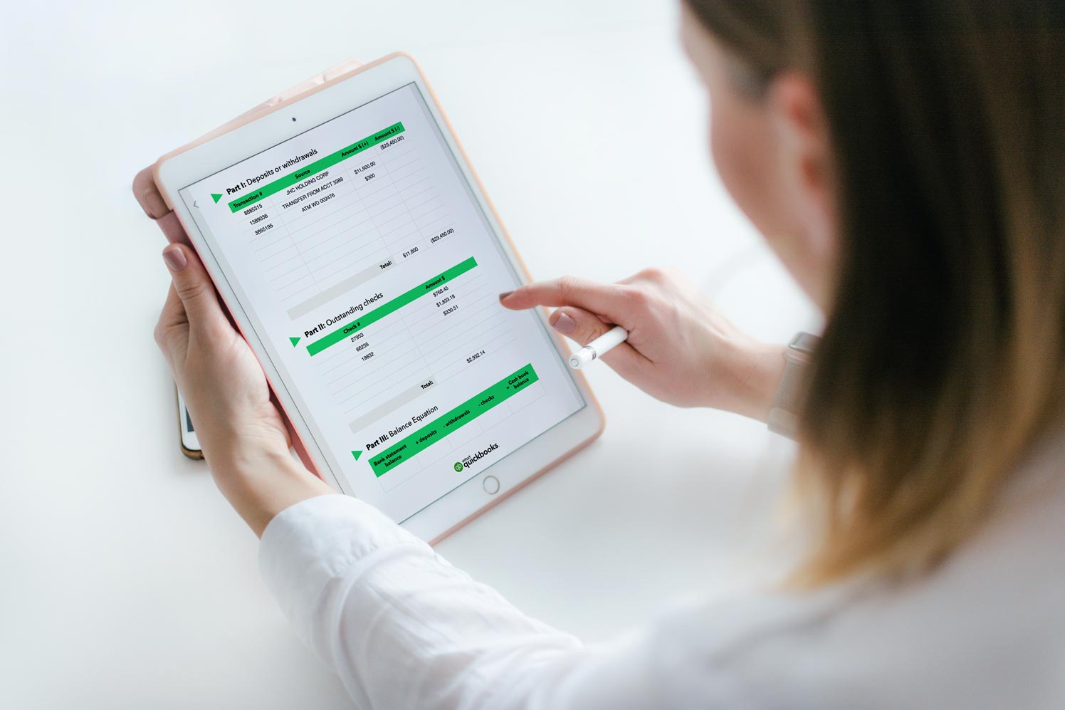 Woman using a bank reconciliation template on a tablet