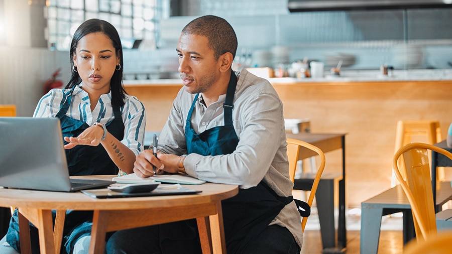 A person and person sitting at a table.