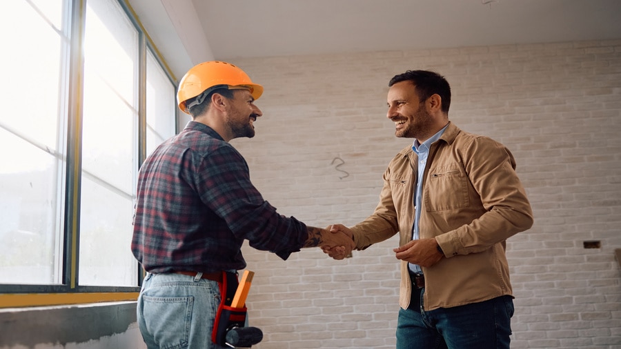 Contractor discusses construction payment schedule with client