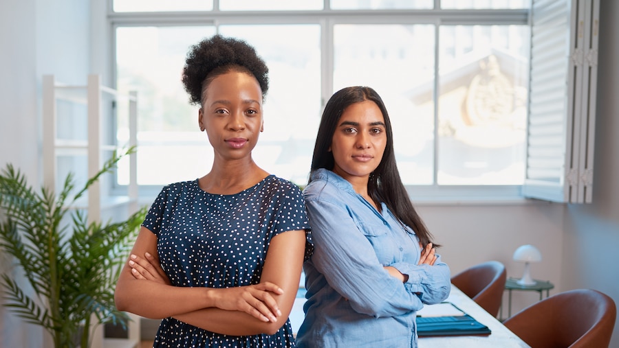 Two female business owners in the workplace.