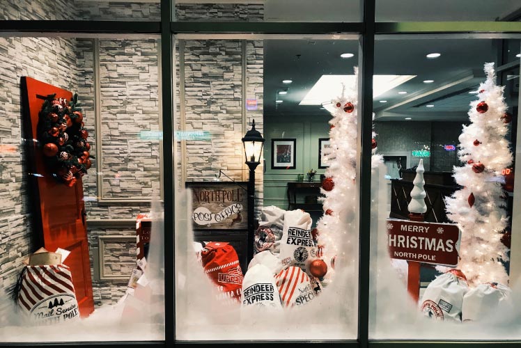 A photo of a store window display with frosted windows