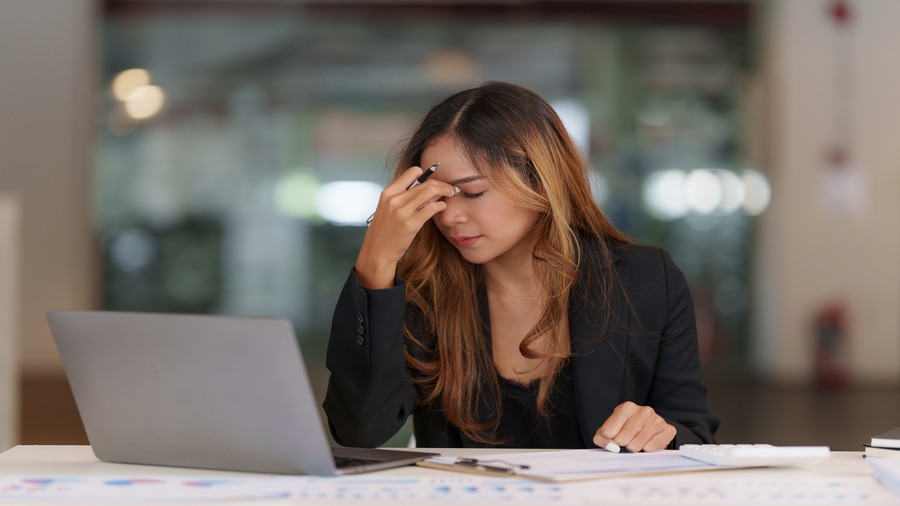 woman frustrated working at a desk