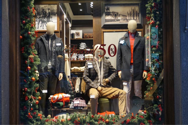 A photo of holiday mannequins in a storefront