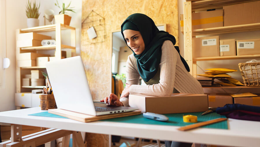 An image of a business owner researching how to register a business.