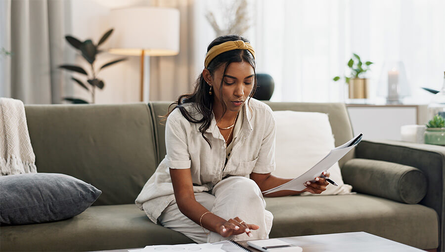 A person sitting on a couch calculating Net operating profit