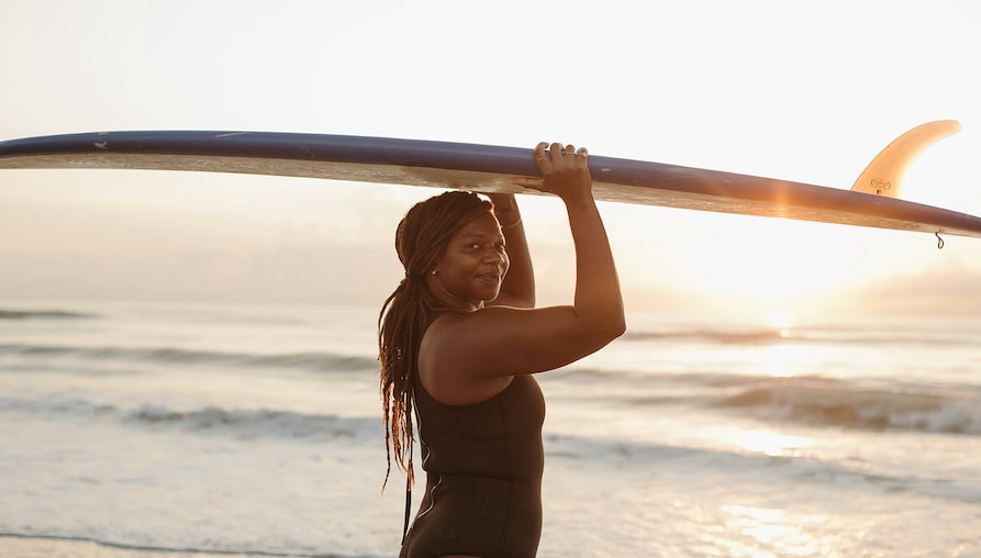 Black small business owner surfing