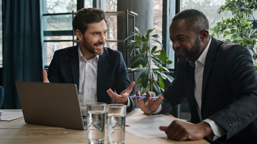 two men discussing business at a table