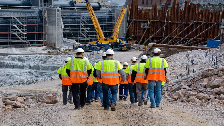 Workers discussing construction KPIs for growing businesses