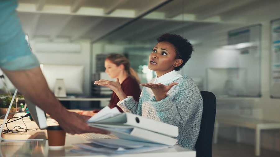 Coworkers discussing HR automation processes