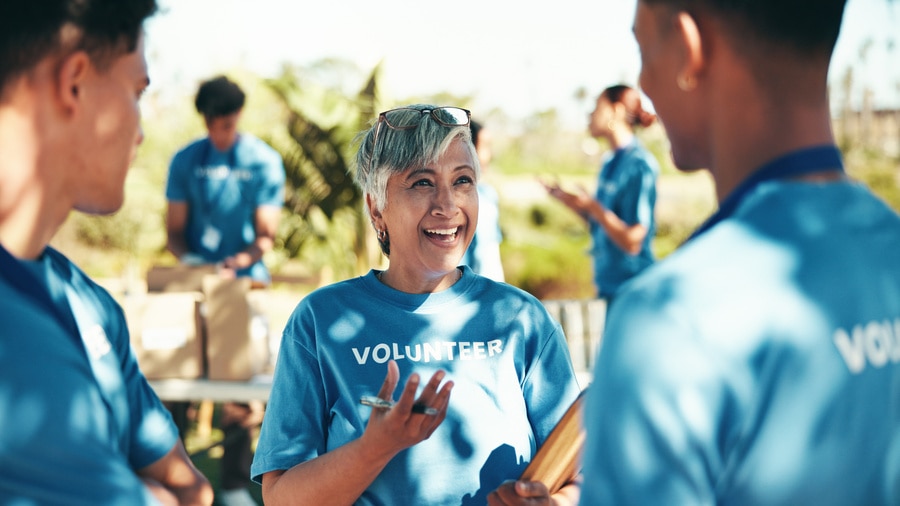 Smiling Volunteers Gather Outdoors for Community Service