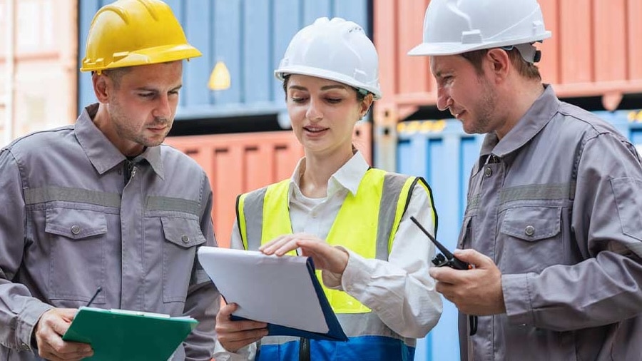 An image showing three professionals performing construction inventory management.