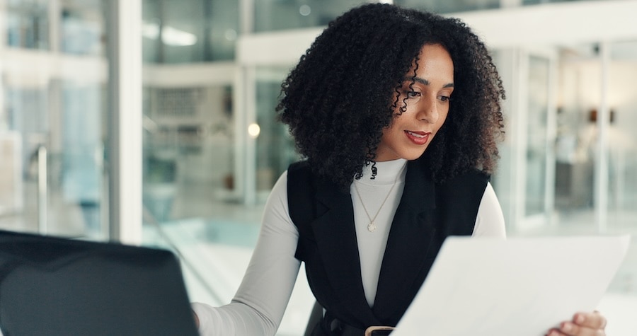 A business owner looking at payroll, while using QuickBooks Workforce.