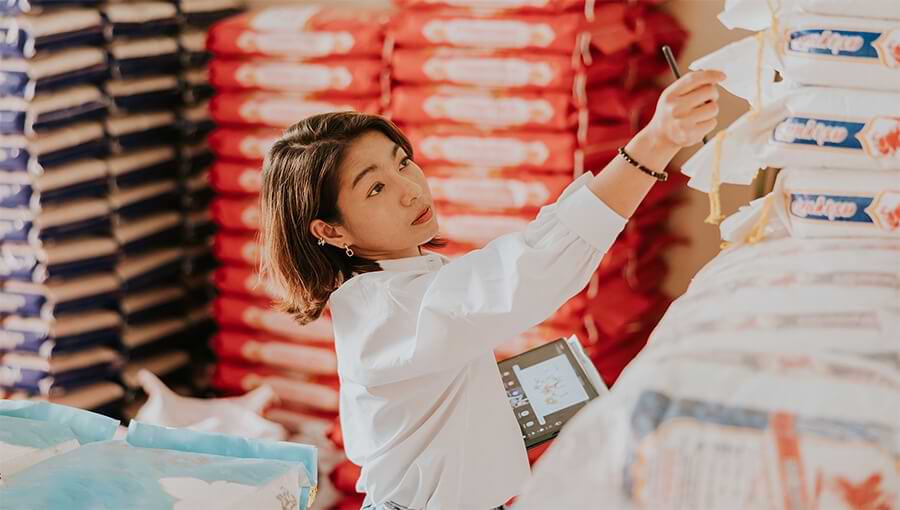 An image of a business owner practicing inventory control best practices.