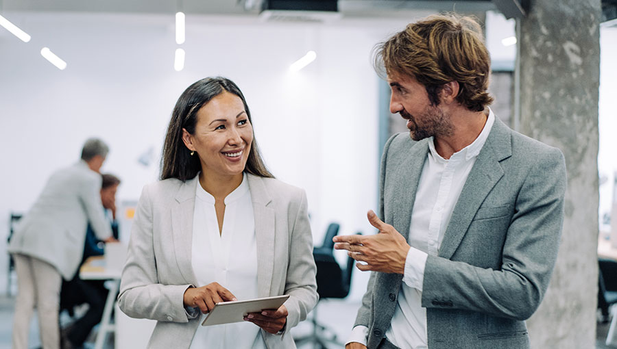 An executive and a manager discussing the difference between liquidity and solvency.
