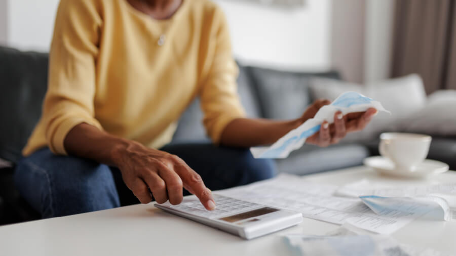 An image of a business owner doing accounting calculations.