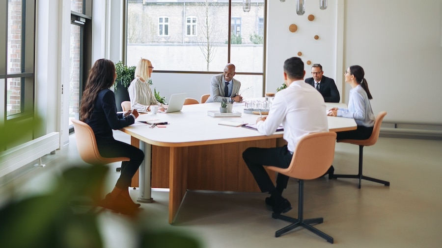 A group of people sitting around a table.