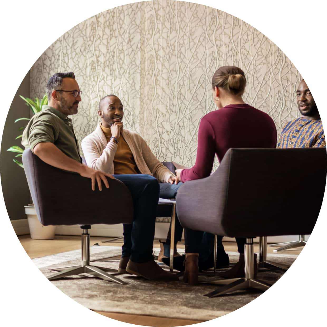 A group of people sitting around a table together.