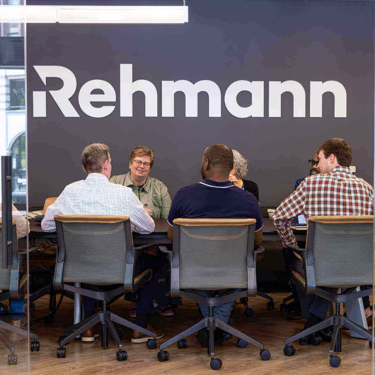 A group of accountants sitting at a conference table.