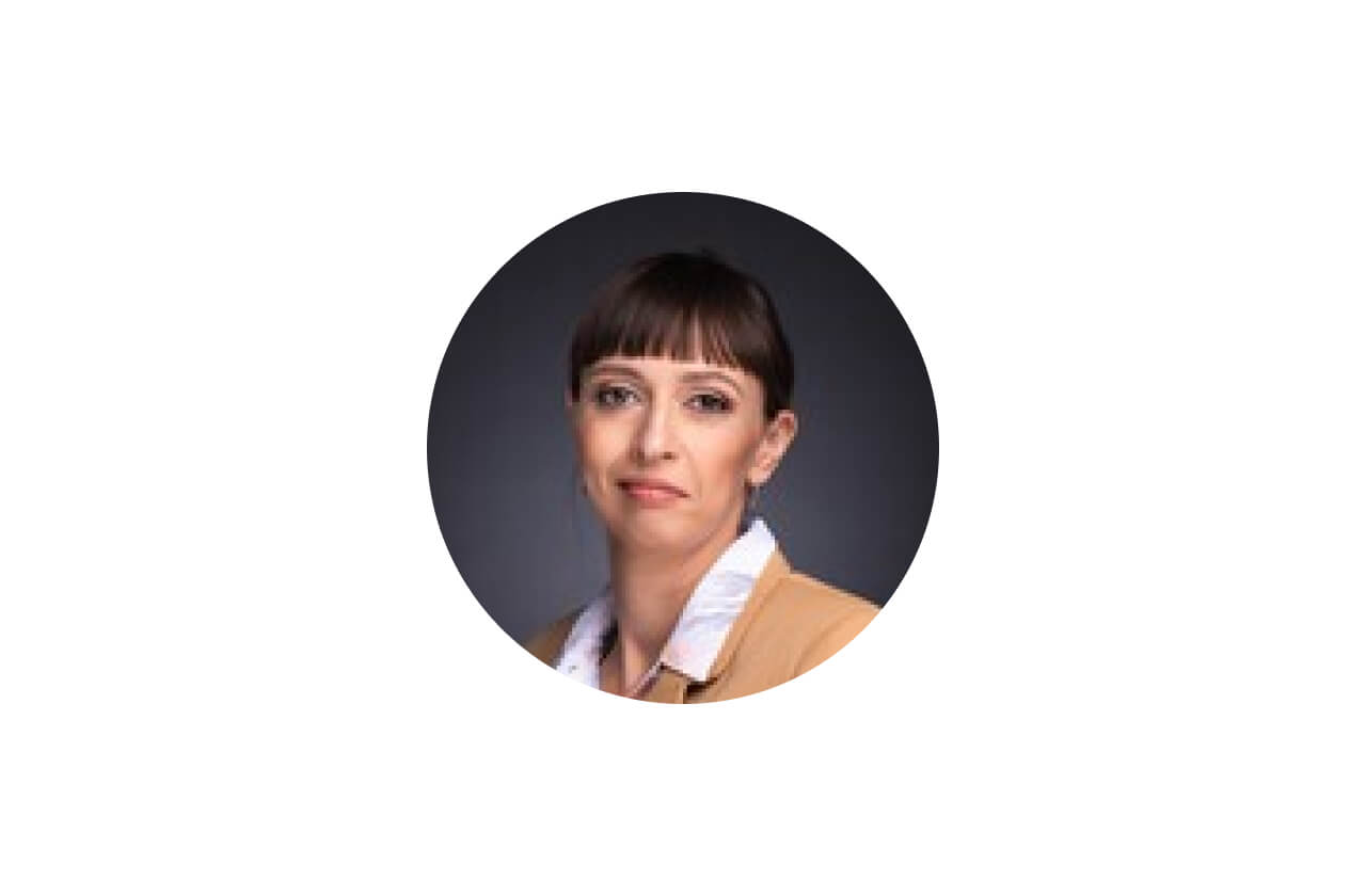 A person wearing a white shirt and a tie.