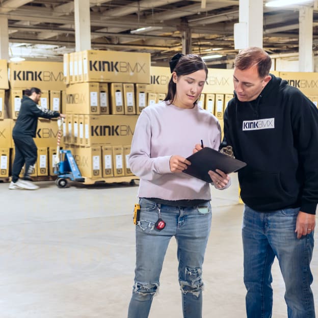 QuickBooks Enterprise customer KinkBMX employees working in busy inventory warehouse