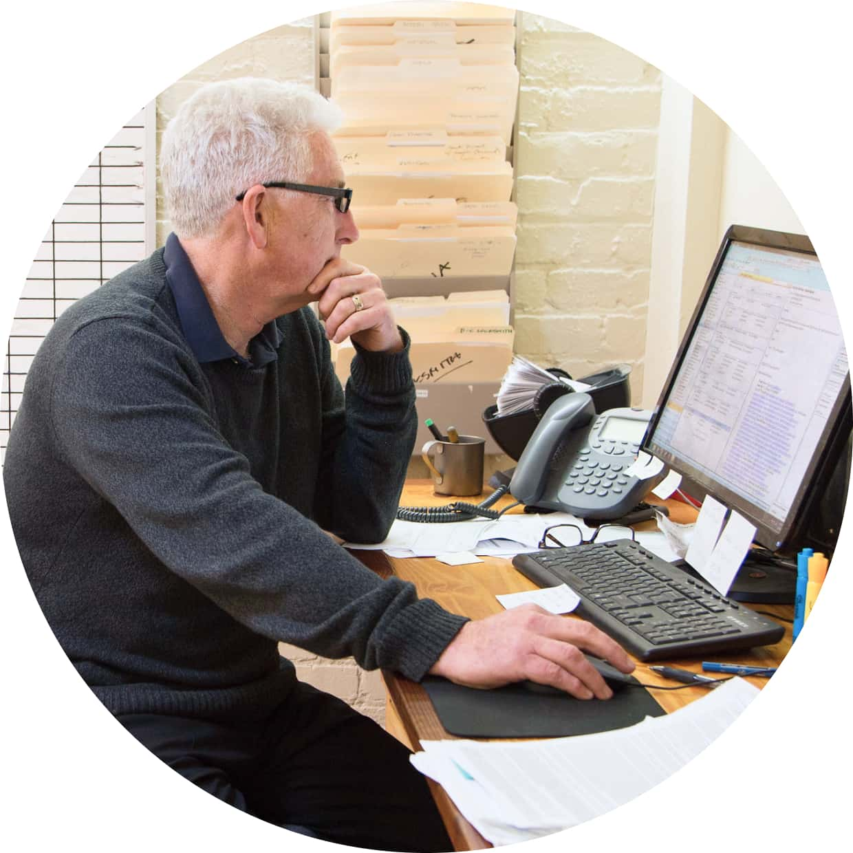 Male QuickBooks Enterprise customer working on a desktop computer