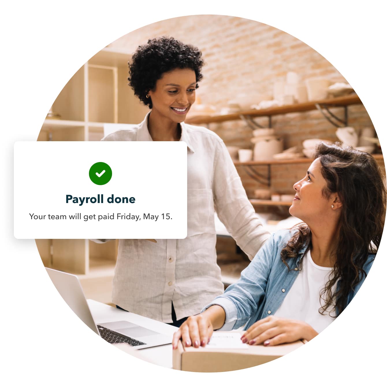 Female business owners at laptop with payroll confirmation