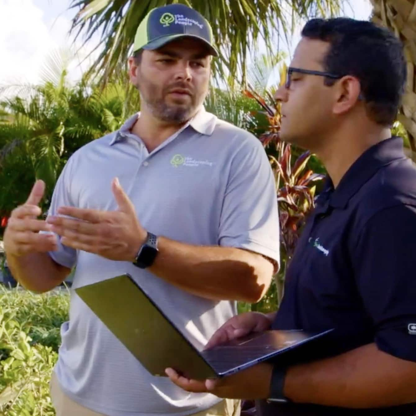 Men discussing a project on a job site