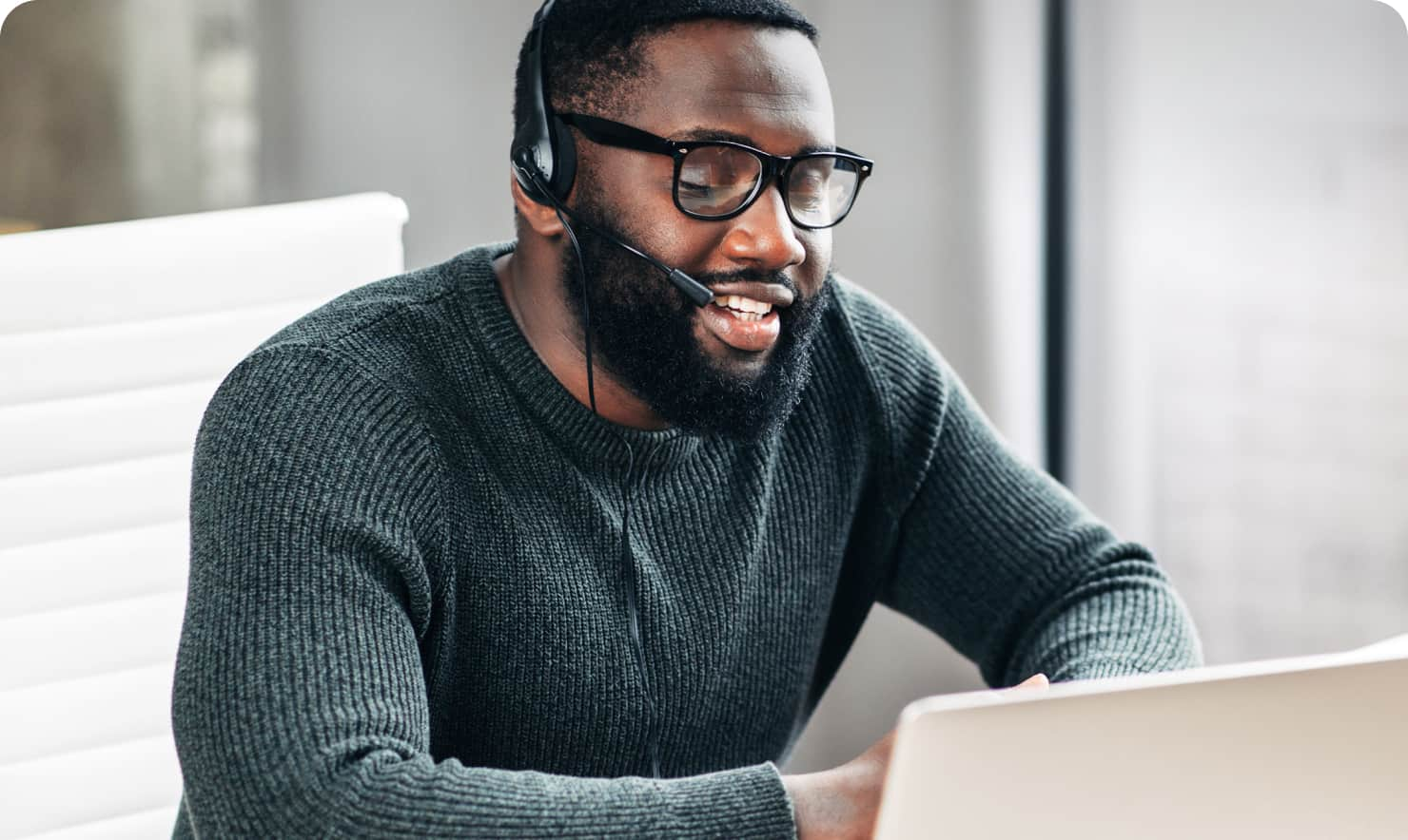 Man providing migration support to a QuickBooks Online customer