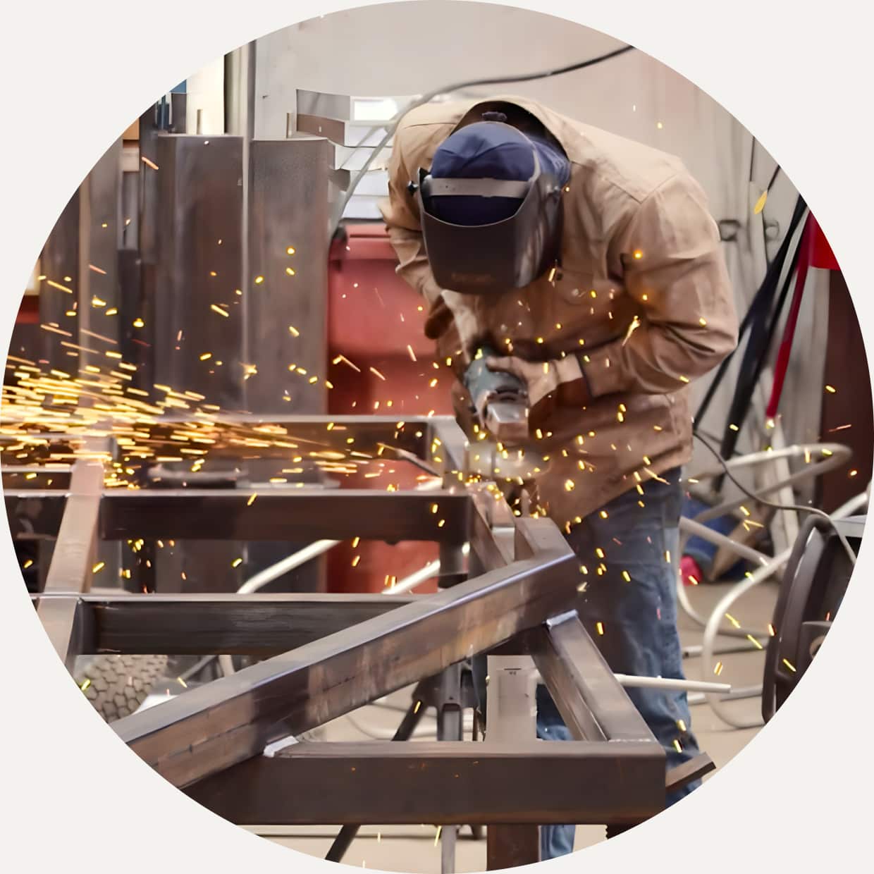 Man welding at a QuickBooks Enterprise for Manufacturers customer's manufacturing plant