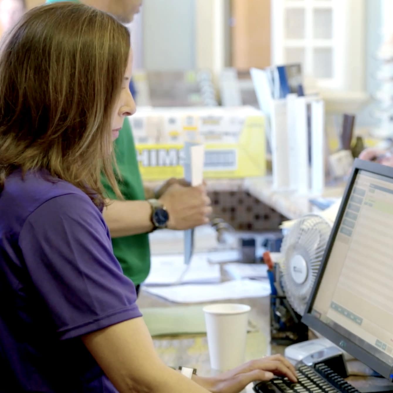 Woman on desktop computer using QuickBooks Enterprise Advanced Reporting