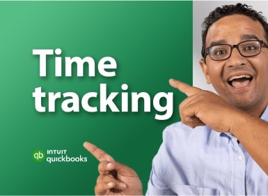 A person pointing to the words time tracking and smiling.