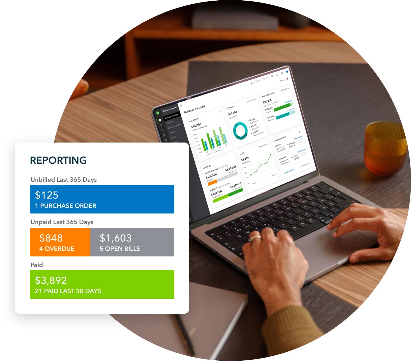 A person holding a laptop computer with a picture of a cat on the screen.