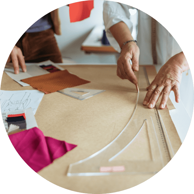 A black and white photo of a cat in a bed.