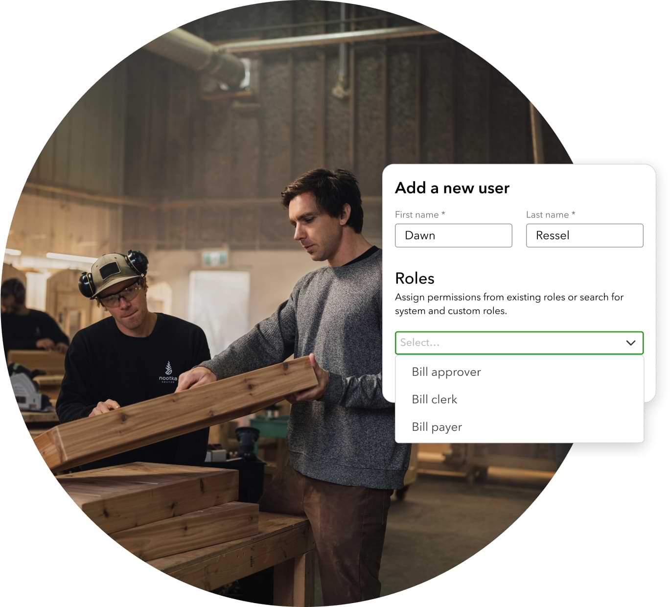 Business owner talking with an employee, with an image of product showing settings to assign roles for users. 