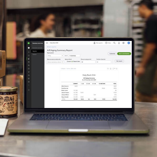 Laptop on the kitchen countertop with summary report on screen.