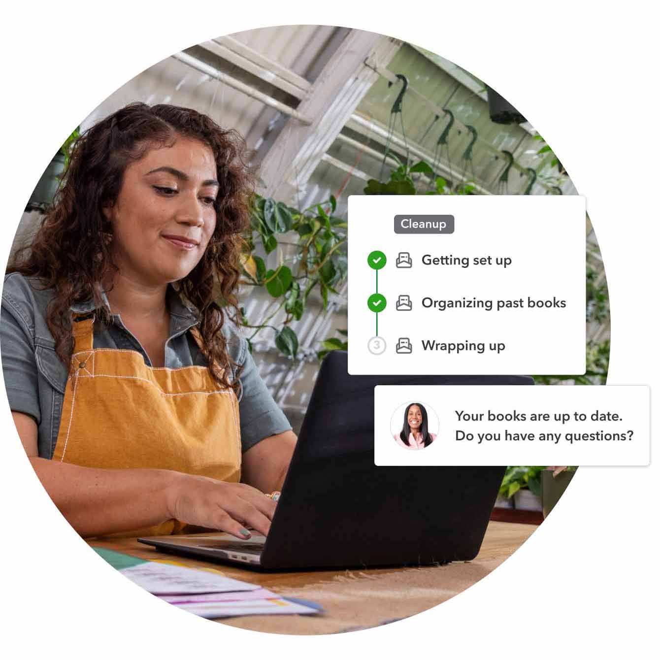 Image of a small nursery business owner, using laptop at a desk in a plant nursery. Overlaying image is the progress bar from QuickBooks product representation of the live bookkeeper clean up service. Step one, "getting set up" is complete, step two, "organizing past books" is complete, step three, "wrapping up" is in progress, and the bookkeeper is asking "Your books are up to date. Do you have any questions?" through chat dialogue bubble.