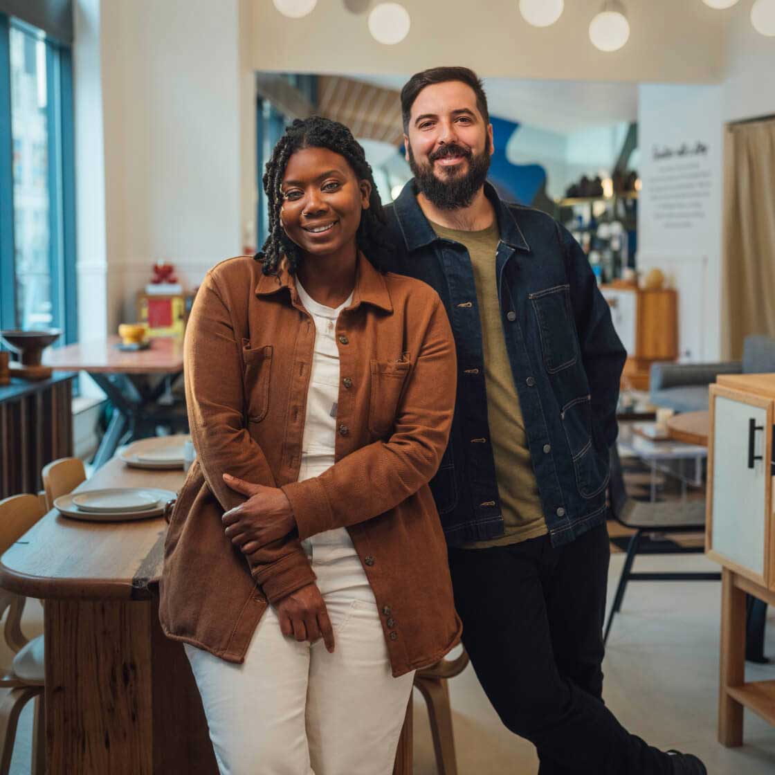 Two persons smiling at the camera