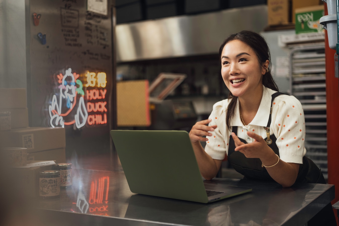 A person sitting at a table with a laptop.