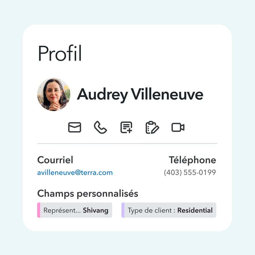 A black and white photo of a person on her phone.